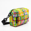 Multicolored plaid patterned bag with a strap on a white background