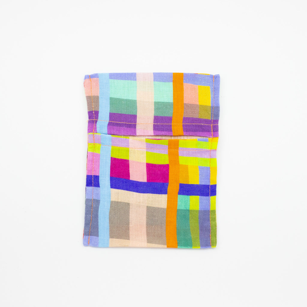 Top view of the Farm pocket tissue holder. This colourful and fun print, with a grid theme, is shuh.’s impression of a birds eye view of a farm