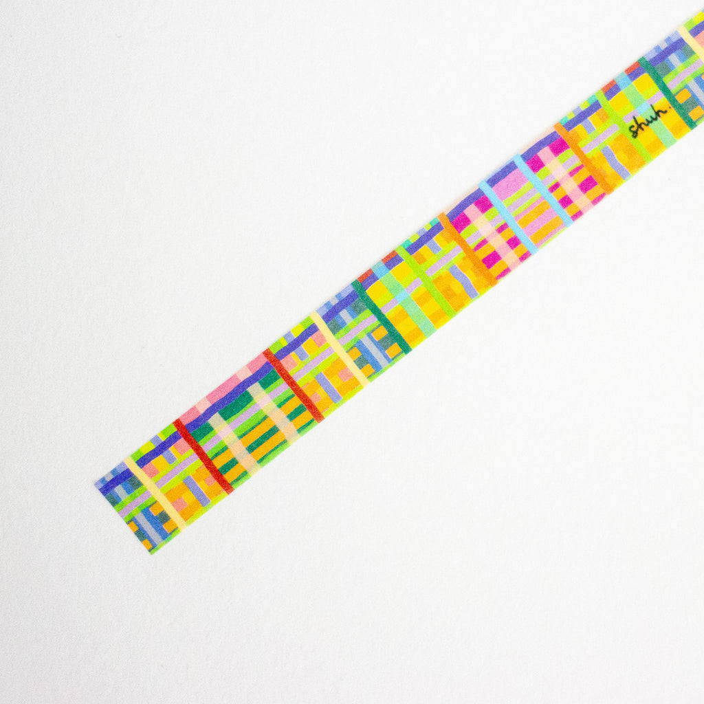 Colorful geometric patterned tape on a white background