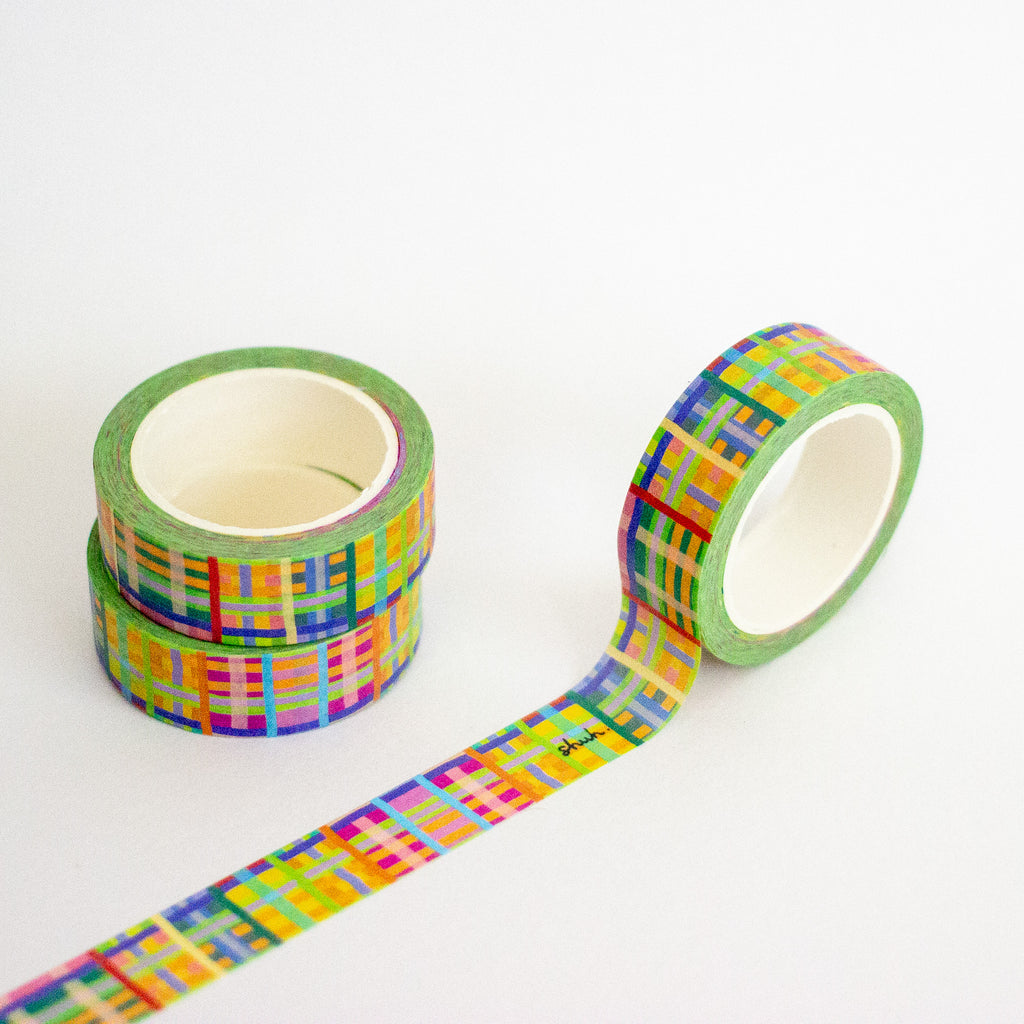 Colorful washi tape with a geometric pattern on a white background