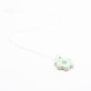 Sterling silver necklace featuring a light green ceramic flower-shaped pendant with a blue dot in the centre, displayed on a white background.