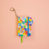 Colourful patterned notebook with keychain on a peach background