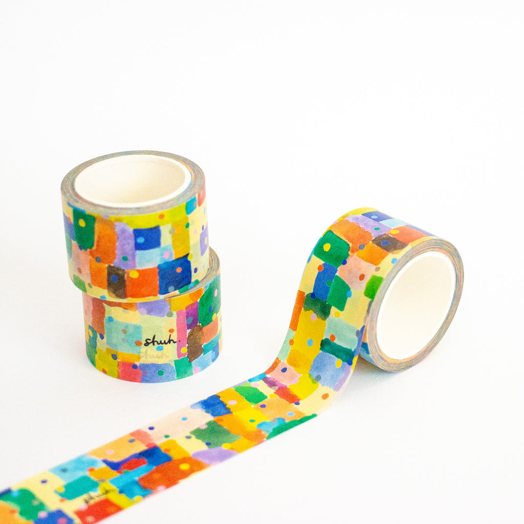 Colorful patterned tape with a visible brand logo on a white background