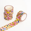 Pink patterned washi tape with cute cartoon drawings, shown as two rolls and a long unrolled strip on a white background.