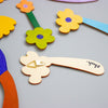 Colourful flower-shaped objects on a grey background