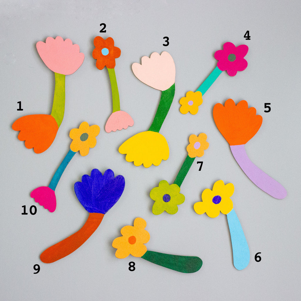 Colourful flower-shaped objects with numbers on a grey background