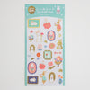 A sheet of Japanese foil sticker sheets featuring cute bunny illustrations, flowers, and decorative frames on a mint green background.