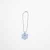 Keychain with a blue flower charm on a white background