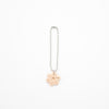 Bag Charm with a light pink flower ceramic charm on a white background