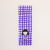 A tall, narrow rectangular bookmark with a purple hand-drawn grid pattern on a white background, featuring a simple black-and-white illustration of a person near the bottom and small text reading 'shuh. printed in australia shuhlee.com'.