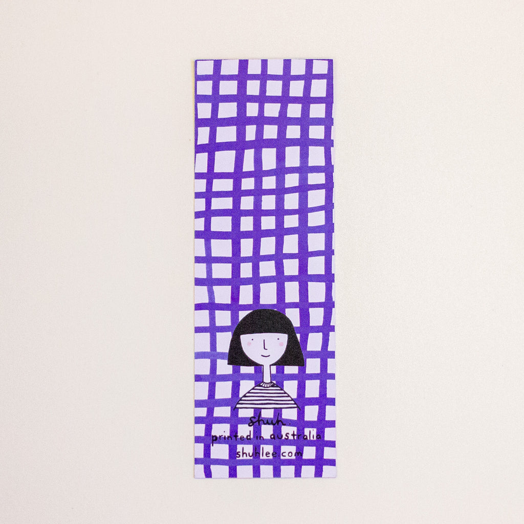 A tall, narrow rectangular bookmark with a purple hand-drawn grid pattern on a white background, featuring a simple black-and-white illustration of a person near the bottom and small text reading 'shuh. printed in australia shuhlee.com'.