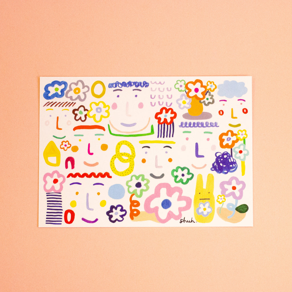 A rectangular postcard featuring colourful illustrations with a white background photographed on a peach backdrop. 