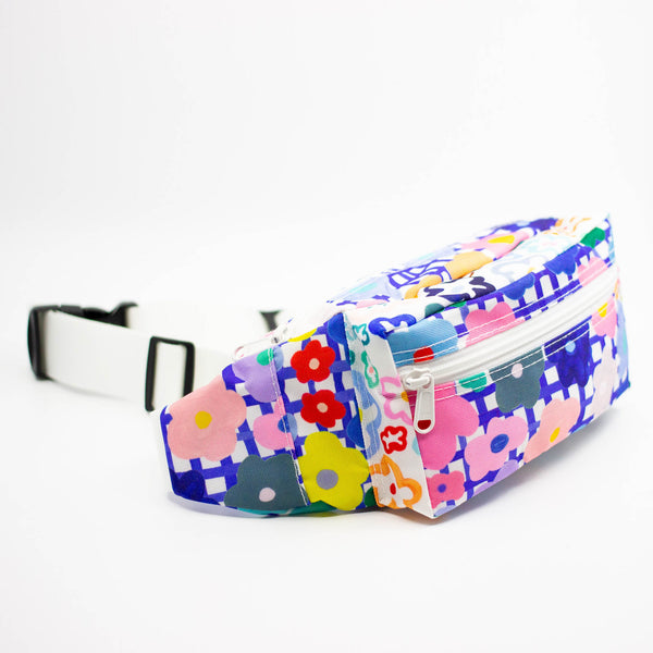 Colorful floral-patterned bum bag on a white background