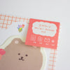 A mini letter set with cute bear-themed stationery, featuring a red-orange card labeled '2 mini letter set' over a white background with a grid pattern and a bear illustration.