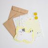 A cute stationery set featuring a yellow cat-shaped die-cut-sheets, matching letterheads, a brown kraft envelope, and two gold paw print stickers on a clean white background.