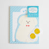 A cute dog-themed mini letter set featuring a white puppy illustration on a light blue striped background, with two gold paw-shaped seals on a small card, photographed on a clean white background.