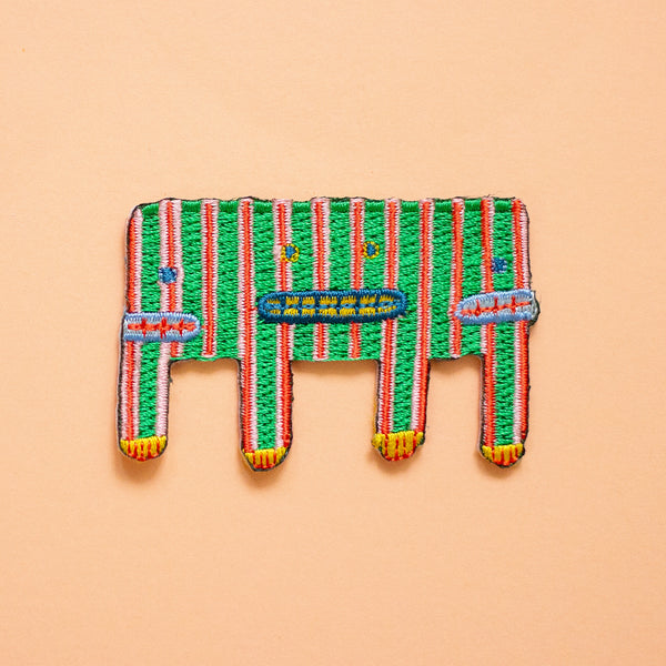 Colorful woven stripey cartoon on a peach background