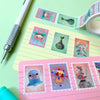 Colourful stationery items with cartoon character stamps on a green background