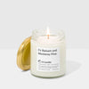 Candle in a glass jar with a label on a white background