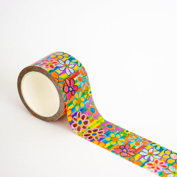 Roll of colorful floral-patterned tape on a white background
