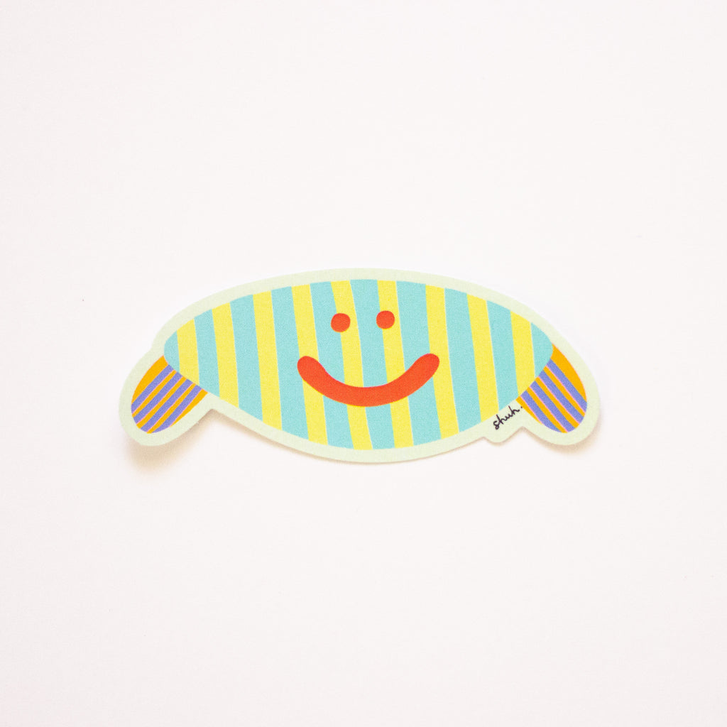 Gerty, an oval monster with striped body and arms, and a bright red smile. 