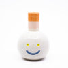 Front view of the Gerty vase. White with orange chimney.
