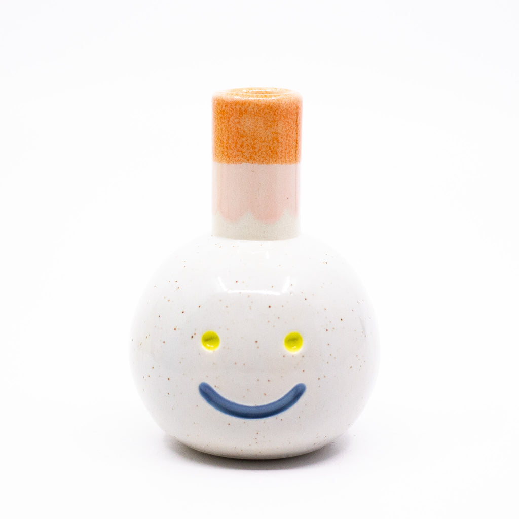 Front view of the Gerty vase. White with orange chimney.