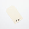 A closeup of the shuh. tulip gift tag. This shows the blank reverse side. 