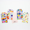 A photo of the collection of shuh. gift tags, with 5 different vibrant multicoloured artistic prints. 