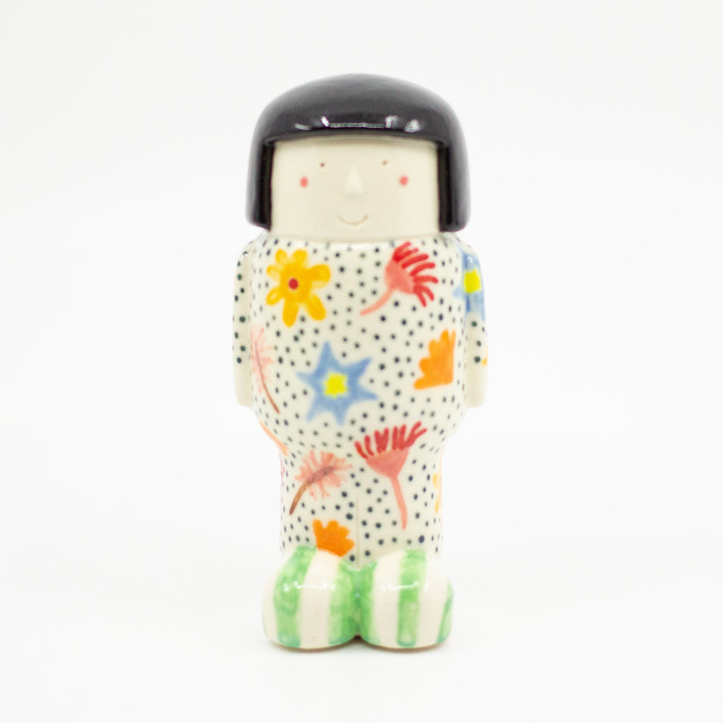 A Front View of the girl figurine number 8. Floral pattern. 