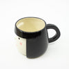 Black mug with a white interior on a white background