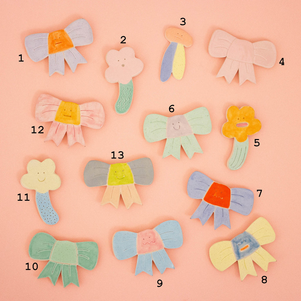 Colorful magnets with corresponding numbers on a pink background