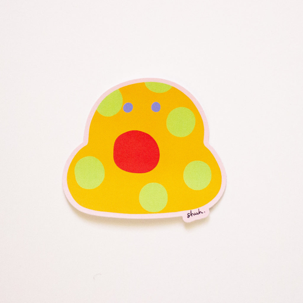 Vinyl sticker, featuring gladys, a orange and yellow polkadot monster with a large red open mouth. 