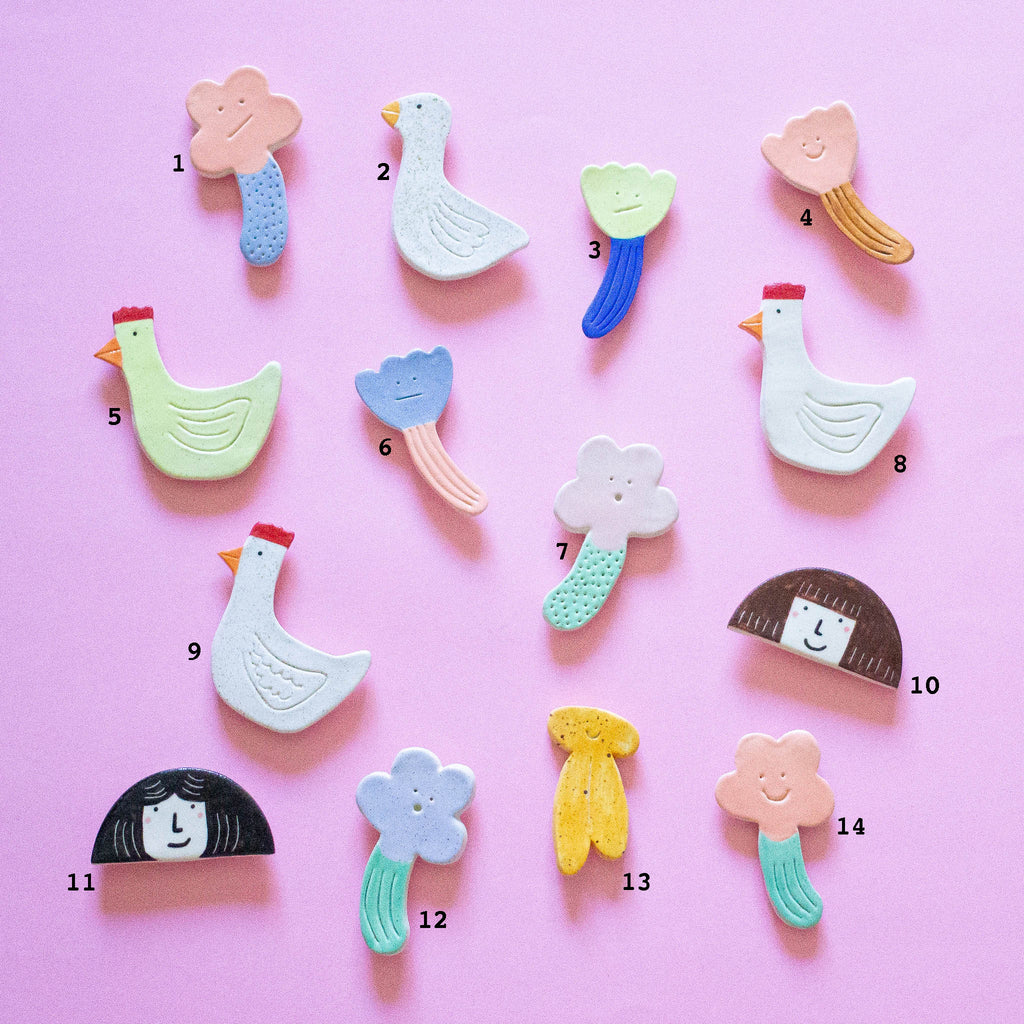 A top down view of the Garden Day magnets collection, with each magnet number to aid in selection. Number 13 is a banana. 