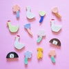 A top view of the Garden Day magnets collection - including ducks, flowers, a banana, and girls head