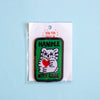 An embroidered patch featuring a white cartoon holding a red heart on a green background with the text 'HANDLE WITH CARE' in black. The patch is displayed on a white backing card with the brand name 'YAN YAN CANDY NG' printed in red, set against a light blue background.