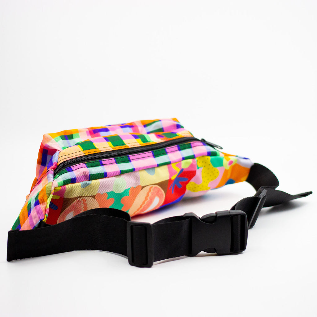 Colorful patterned fanny pack on a white background
