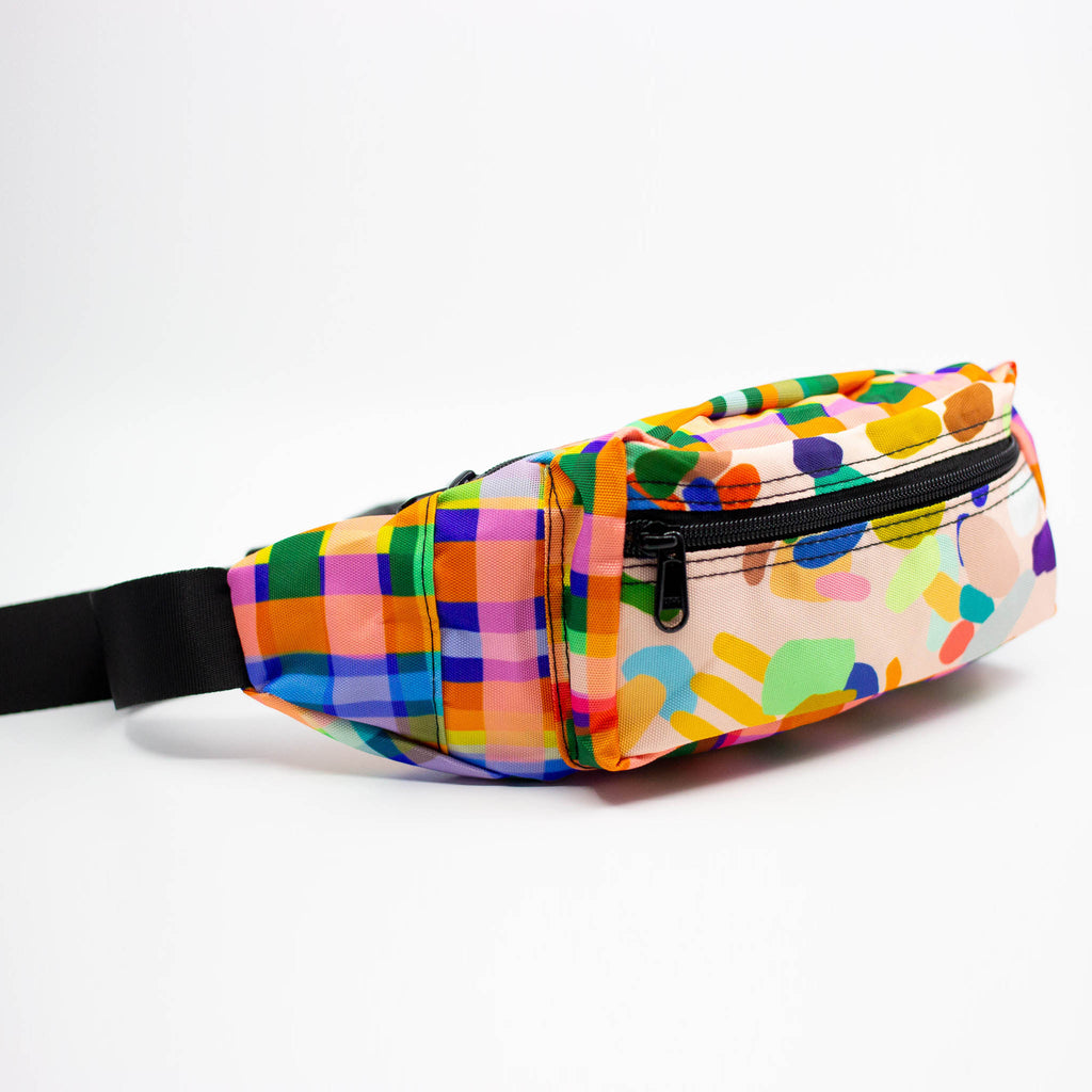 Colorful patterned fanny pack on a white background