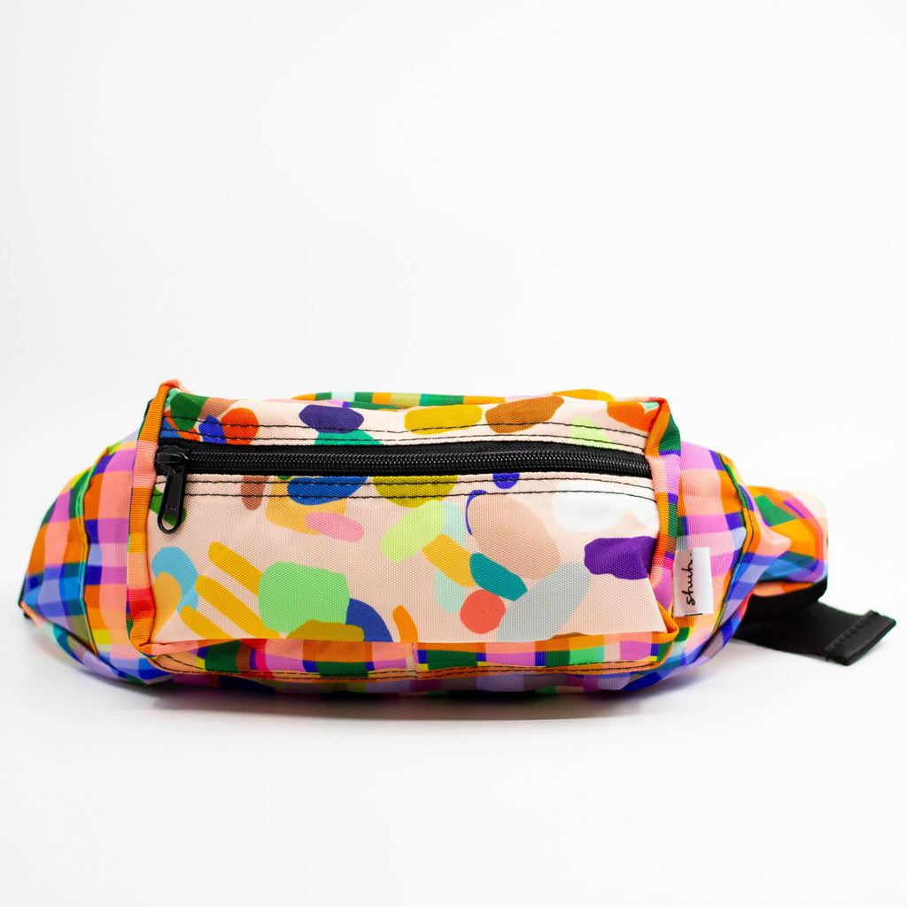 Colorful patterned fanny pack on a white background
