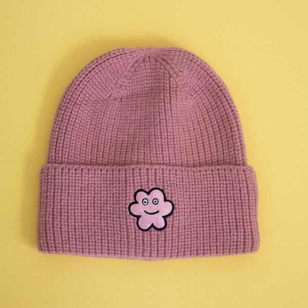 Dusty Pink knit beanie with a pink flower design embroidered.