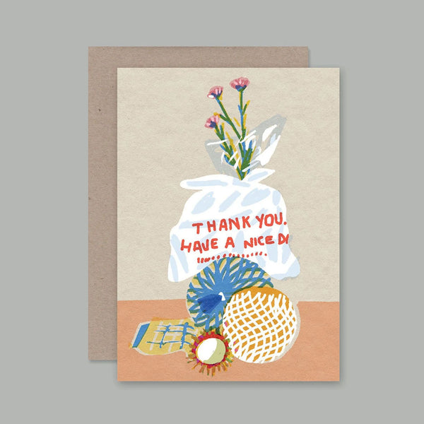 A greeting card with a kraft envelope, featuring an illustration of a white plastic bag with pink flowers and the text 'THANK YOU. HAVE A NICE DAY.