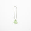Keychain with a green heart-shaped charm on a white background