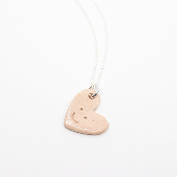 Heart-shaped pendant on a white background