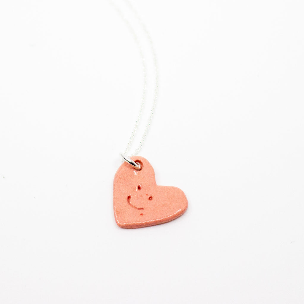 Heart-shaped pendant on a white background