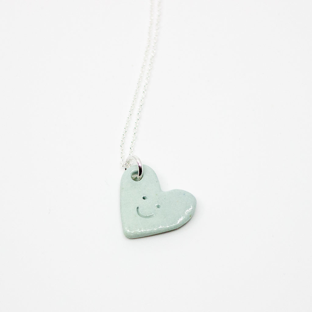 Sky Blue heart-shaped pendant on a white background