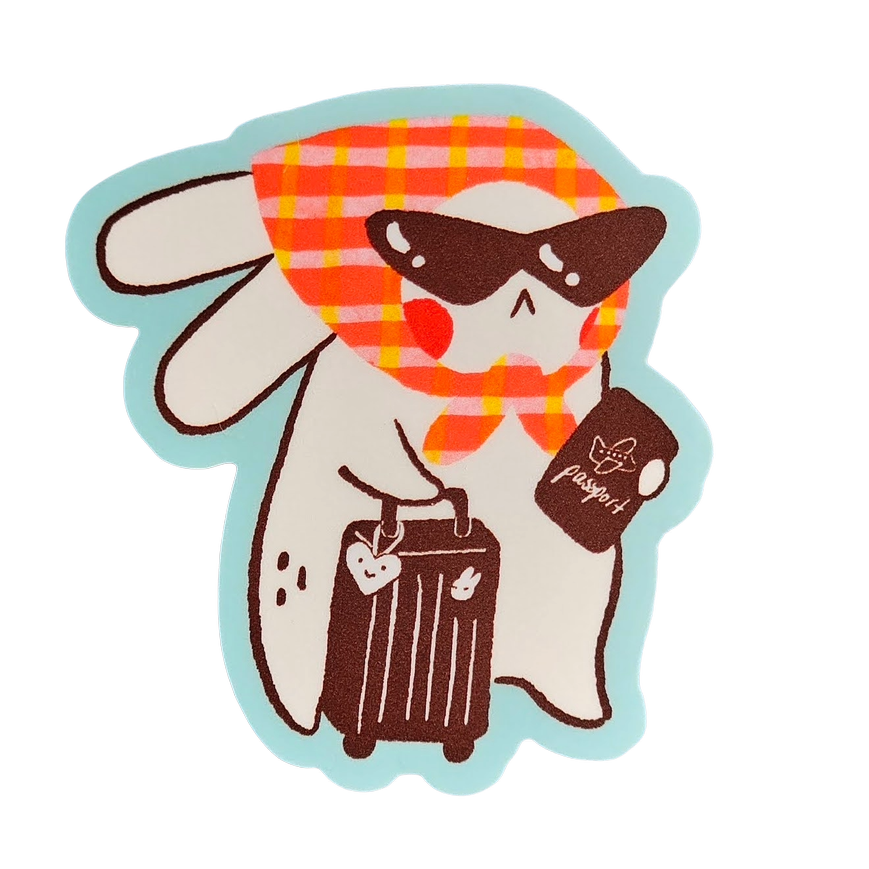 A cute cartoon bunny character sticker with a red and orange plaid scarf, sunglasses, holding a brown suitcase and a passport, on a white background with a light blue outline.