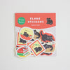 A package of home cat themed flake stickers, featuring a red header card with white text and several colourful die-cut stickers showing black cats in various scenarios, displayed on a light grey background.