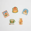 Five cute cartoon bear stickers with winter and reading-themed designs, arranged on a plain white background.