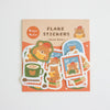A package of cute home-themed sticker flakes featuring cartoon bears wearing red hats and reading books, displayed on a light background.
