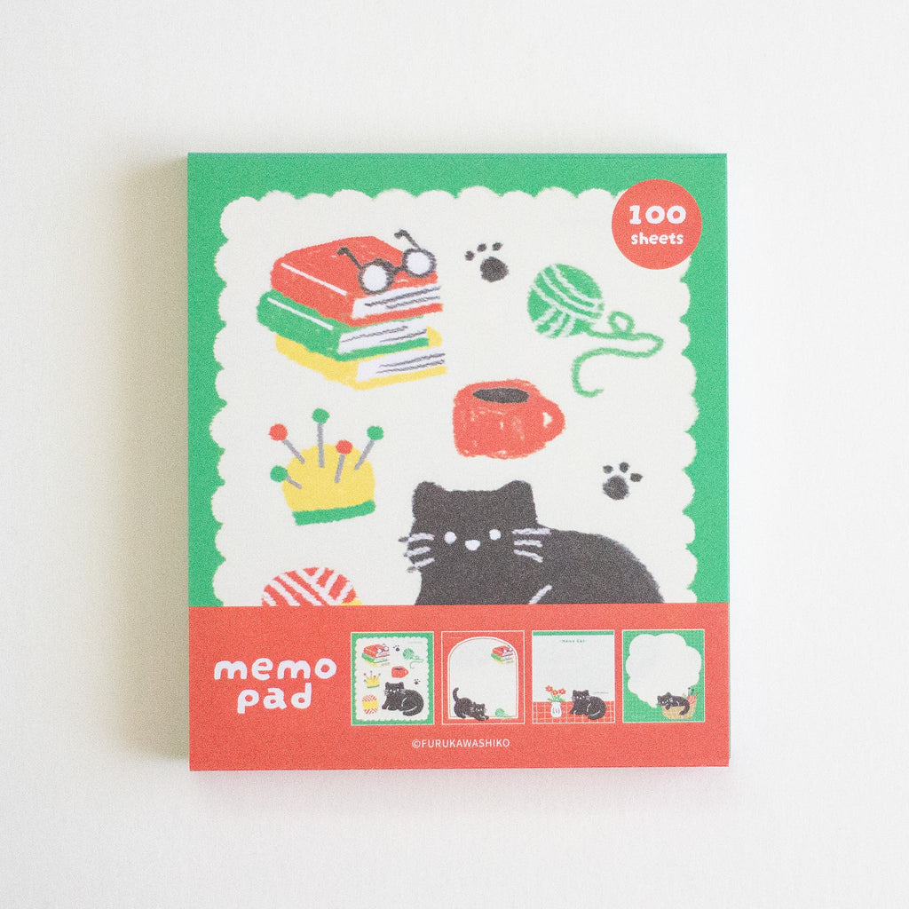 A square memo pad with a colourful illustrated cover featuring a black cat, books, glasses, yarn ball, mug, paw prints, and small preview panels along the bottom. The top right says '100 sheets' and the bottom reads 'memo pad'.